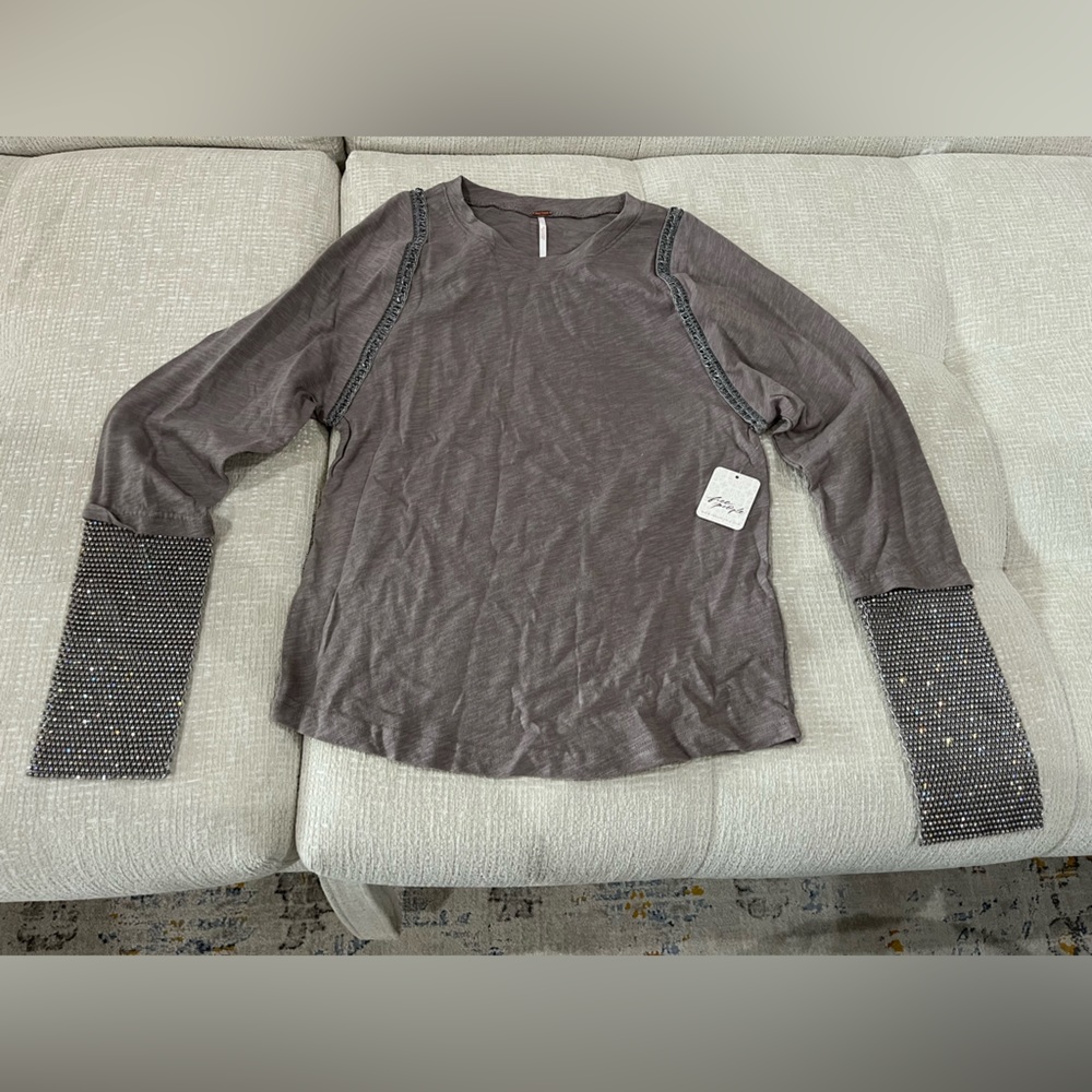 New, with tags, Free People long sleeve shirt with rhinestone sleeves.